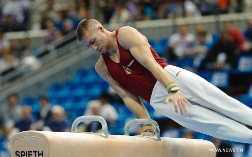 Hungary's Krisztian Berki competes on the pommel horse during the 5th Men's and Women's Artistic Gymnastics Individual European Championships in Moscow, Russia, April 17, 2013. The event kicked off here on Wednesday.(Xinhua/Jiang Kehong) 