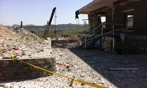 An explosion ripped through an explosives manufacturing plant in Zhangqiu, Shandong Province Monday morning. The blast, which destroyed a workshop, killed 13 and injured 19. Rescuers are still searching for 10 more missing employees. Photo: CFP