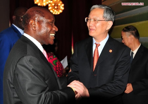 Cote d'Ivoire Prime Minister Daniel Kablan Duncan (L) meets with Zhong Jianhua, a special envoy of the People's Republic of China in Africa, in Abidjan, March 25, 2013. (Xinhua/Wu Changrong) 