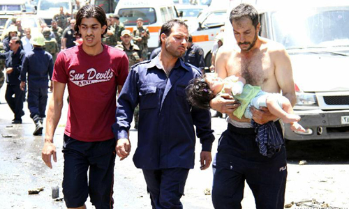 Photo provided by Syrian Arab News Agency (SANA) shows that peopel walk away from the blast site in Damascus, Syria, on June 8, 2012. An explosive-laden vehicle went off at a suburban area in Syrian capital Damascus Friday, killing two people, pro-government al-Ekhbaria TV reported. Photo: Xinhua/SANA 
