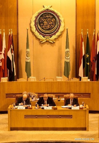 Nabil El-Arabi (L), secretary general of the Arab League, Amr Abo El-Ata (C), president of the emergency meeting and Egypt's permanent delegate to the Arab League (AL), and AL Deputy Secretary General Ahmed bin Helli are seen during the Arab League emergency meeting at the level of permanent delegates to discuss the latest Israeli assaults on Al-Aqsa mosque, one of the three most sacred mosques for Muslims, at the AL headquarters in Cairo, May 12, 2013. (Xinhua/Amru Salahuddien) 