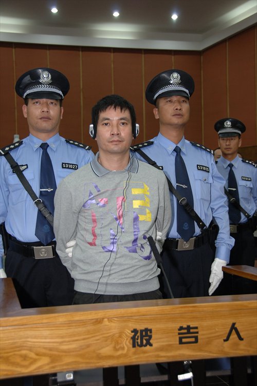 Naw Kham, 43, the head of an armed drug gang from Myanmar, stands trial in Kunming, Yunnan Province. Photo: CFP