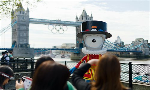 Olympic mascot Beefeater Mandeville is displayed on a footpath on the banks of the river Thames in central London on July 22, 2012.Photo: AFP