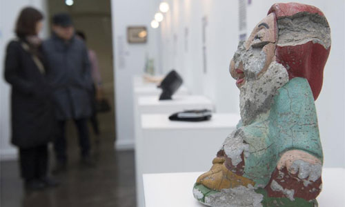 People visit the Museum of Broken Relationships in Zagreb, Croatia, Feb. 12, 2013. More and more people visit the Museum of Broken Relationships as the Valentine's Day approaches. The Museum of Broken Relationships grew from a traveling exhibition to the unique collection of failed relationships memorabilia donated by heart broken people all over the world. Photo: Xinhua 
