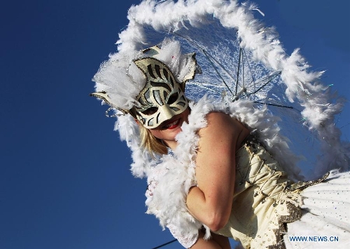 A performer takes part in the flowers parade during the 129th annual Nice Carnival parade, in Nice, southern France, March 2, 2013. (Xinhua/Gao Jing) 