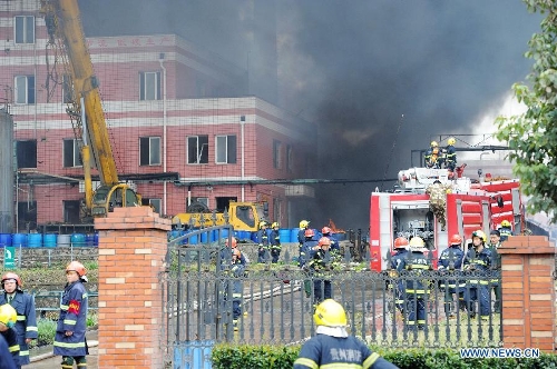 Firemen work at the scene of a chemical plant blast in Baiyun District of Guiyang, capital of southwest China's Guizhou Province, Feb. 25, 2013. At least five people were injured in a chemical plant explosion in Guiyang on Monday morning. Part of the plant, which belongs to Bestchem, a local chemical company, was still burning by noon. Firefighters have been deployed to the blast scene while local environmental authorities are keeping an eye on the air quality. (Xinhua/Liu Xu)  