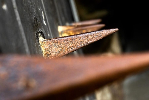 &nbsp;Photo taken on April 28, 2013 shows nails on the gate of Fort Jesus in Mombasa, Kenya. The Fort, built by the Portuguese in 1593-1596 to the designs of Giovanni Battista Cairati to protect the port of Mombasa, is one of the most outstanding and well preserved examples of 16th Portuguese military fortification and a landmark in the history of this type of construction. The Fort's layout and form reflected the Renaissance ideal that perfect proportions and geometric harmony are to be found in the human body. The property covers an area of 2.36 hectares and includes the fort's moat and immediate surroundings. The UNESCO added the Fort Jesus to World Heritage List as a cultural site in 2011. (Xinhua/Meng Chenguang) 