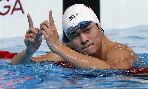 China's Sun Yang reacts after the heats of the men's 800 meters freestyle swimming event at the FINA World Championships on Tuesday in Barcelona. Photo: IC