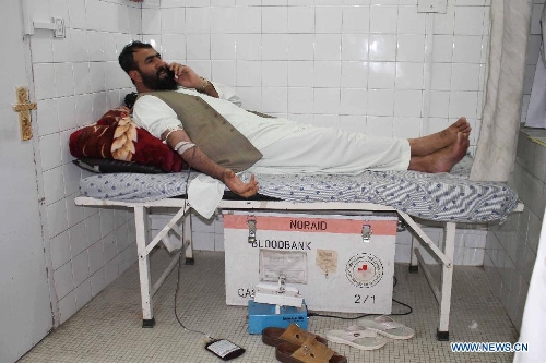 A wounded man receives treatment at a hospital in Kandahar, Afghanistan, on May 17, 2013. At least nine people were killed and more than 55 others wounded Friday evening when two back-to-back explosions rocked Kandahar city, capital of the southern Afghan province of Kandahar, a provincial government spokesman said. (Xinhua/Arghand)Related:Twin blasts kill 9, wounds 55 in Afghanistan's KandaharKANDAHAR, Afghanistan, May 17 (Xinhua) -- At least nine people were killed and more than 55 others wounded Friday evening when two back-to-back explosions rocked Kandahar city, capital of the southern Afghan province of Kandahar, a provincial government spokesman said.