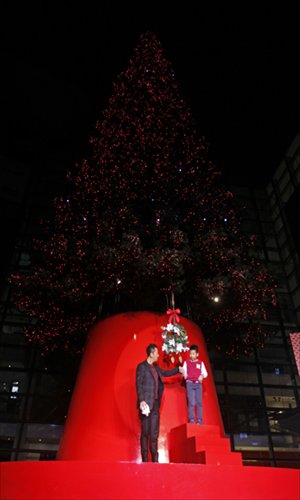 Chinese actor Guo Tao and his son test the special Christmas decorations in Xintiandi and help turn on the glittering lights for the venue. Photo: Cai Xianmin/GT