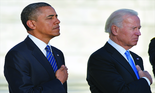 US President Barack Obama and Vice President Joe Biden lay a wreath at the Tomb of the Unknown Soldiers at Arlington National Cemetery in Arlington, Virginia, on Sunday. Obama and Biden were officially sworn in for a second term in office on Sunday. Photo: AFP