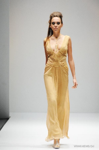 A model presents a creation of Dubai based label GisellaBlu's evening and party wear collection at the Audi Fashion Festival held in Singapore's Marina Bay, May 17, 2013. (Xinhua/Then Chih Wey) 