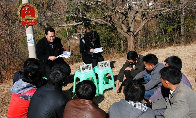 A trial concerning a land dispute between villagers opens in the countryside of Weining Yi, Hui and Miao Autonomous County, Guizhou Province on January 23. Photo: CFP