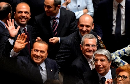 Silvio Berlusconi (front L), the leader of the freedom of people, waves to media in Rome, Italy, on April 20, 2013. Italian President Giorgio Napolitano on Saturday won election for a second mandate in a move to solve Italy's political impasse. (Xinhua/Xu Nizhi) 