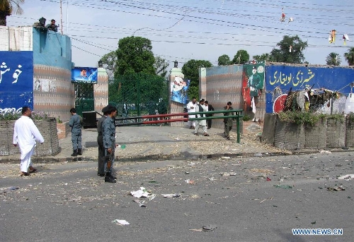 Policemen inspect the blast site in Jalalabad, capital of east Afghanistan's Nangarhar Province, May 15, 2013. A policeman was killed, another policeman and seven civilians were wounded when an IED went off in Jalalabad on Wednesday. (Xinhua/Tahir Safi)