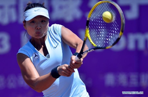 Zhou Yimiao of China hits a return to Chan Chinwei of Chinese Taipei during the third round match of the women's singles at the 2013 ITF Women's Circuit in Huzhu, northwest China's Qinghai Province, June 28, 2013. Zhou Yimiao lost 0-2.(Xinhua/Wang Bo) 