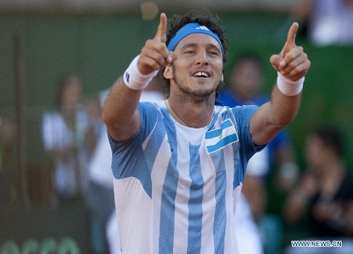 Argentina's Juan Monaco celebrates after the Davis Cup's quarter final match against Gilles Simon of France at Mary Teran de Weiss Stadium in Buenos Aires, capital of Argentina, on April 5, 2013. Juan Monaco won the match. (Xinhua/Martin Zabala)  