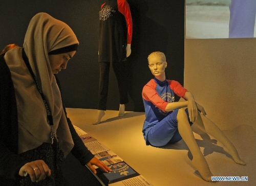 People visit the creation at the Muslim women's fashion exhibition held in Sydney, Australia, April 24, 2013. The exhibition displayed works of Australian designers' new generation. (Xinhua/Jin Linpeng) 