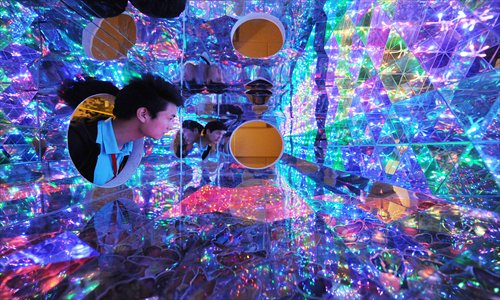 A staff member tests the Magic Box, an exhibit at the Ripley's Believe It or Not! Museum in the Shanghai Bund Sightseeing Tunnel. The international franchise, which features bizarre attractions, is slated to open later this month. Photo: CFP