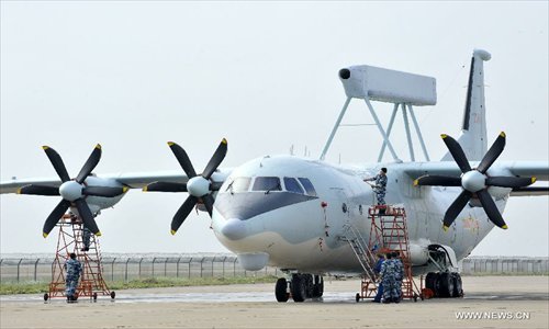 Maintenance staff members of Bayi Aerobatic Team of the People's Liberation Army (PLA) Air Force, check a plane in Zhuhai, south China's Guangdong Province, November 12, 2012. The 9th China International Aviation and Aerospace Exhibition will kick off on Tuesday in Zhuhai. Photo: Xinhua