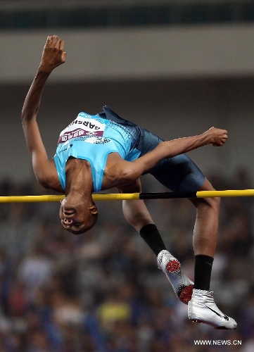 Qatar's Mutaz Essa Barshim competes in the men's high jump during the IAAF Diamond League Athletics meet in Shanghai, east China, May 18, 2013. Barshim won the first place of the event in 2.33 meters.(Xinhua/Li Ming) 