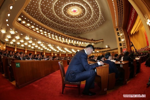 Yao Ming (C), a member of the 12th National Committee of the Chinese People's Political Consultative Conference (CPPCC), attends the opening meeting of the first session the 12th CPPCC National Committee at the Great Hall of the People in Beijing, capital of China, March 3, 2013. The first session of the 12th CPPCC National Committee opened in Beijing on March 3. (Xinhua/Li Gang)  