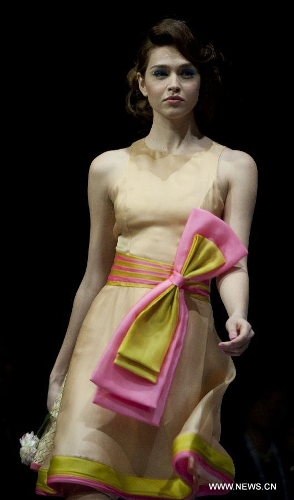 A model presents a creation of Indonesian brand Jeanny Ang Couture's 2013 spring/summer series at the 11th 