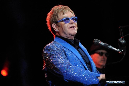 British singer Elton John performs during his concert at the Gran Parque Central in Montevideo, capital of Uruguay, March 4, 2013. (Xinhua/Nicolas Celaya)