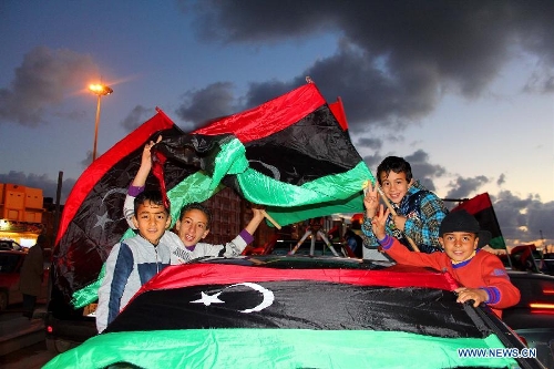 &nbsp;Libyan people attend a celebration for the second anniversary of the uprising that toppled the regime of strongman Muammar Gaddafi in Benghazi, on Feb. 17, 2013. (Xinhua/Mohammed El Shaiky) 