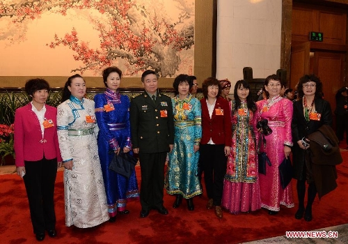 Deputies to the 12th National People's Congress (NPC) pose for a photo before the closing meeting of the first session of the 12th NPC at the Great Hall of the People in Beijing, capital of China, March 17, 2013.(Xinhua/Chen Shugen)  