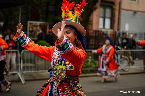 People participate in the annual Dance Parade in New York, on May 18, 2013. Over 200 dance groups showcasing 80 unique dance styles and cultures gathered from Broadway to the East Village on Saturday for the 7th Dance Parade in New York. (Xinhua/Niu Xiaolei) 