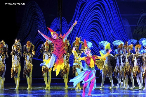 Dancers perform in the rehearsal of the musical Hundred-bird Dress in Nanning, capital of south China's Guangxi Zhuang Autonomous Region, April 27, 2013. The musical tells a legend of the Zhuang ethnic group about a young hero's sacrifice in protecting the homeland against an evil polluting power. (Xinhua/Liu Jun) 