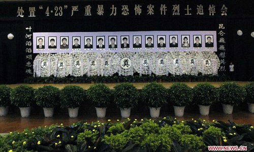 Photo taken on April 29, 2013 shows the scene of a memorial meeting for the 15 community workers and police officers who died during a terrorist clash on April 23 in Bachu County, Kashgar Prefecture, northwest China's Xinjiang Uygur Autonomous Region. During a commendation meeting held on Monday, the regional Communist Party of China (CPC) committee and government posthumously awarded the 15 individuals each as a 