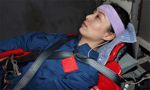 Wang Yaping, a female astronaut of China's Shenzhou-10 manned spacecraft, prepares to attend a training on a centrifuge April 25, 2013.  Photo: Xinhua