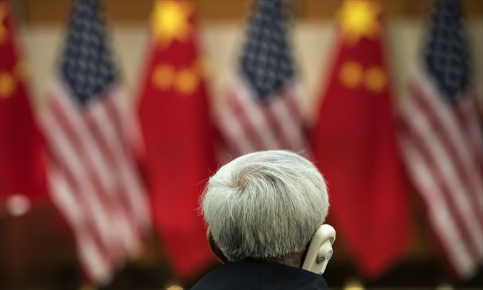 An official listens during a Strategic Track Plenary Session at the US Department of State Thursday in Washington. Officials from the US and China met to discuss the two world powers' relationship. The two-day dialogue concluded Thursday. Photo: AFP