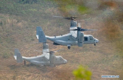 Two MV-22 Osprey tilt-rotor aircrafts is seen during the Cobra Gold exercise in Sukhothai, Thailand, Feb. 21, 2013. The 11-day multinational military exercise ended on Thursday. An estimated 13,000 servicemen from seven countries were participating in the Cobra Gold exercise, including those from Singapore, Malaysia, Indonesia, Japan, South Korea, the United States and Thailand. (Xinhua/Gao Jianjun) 