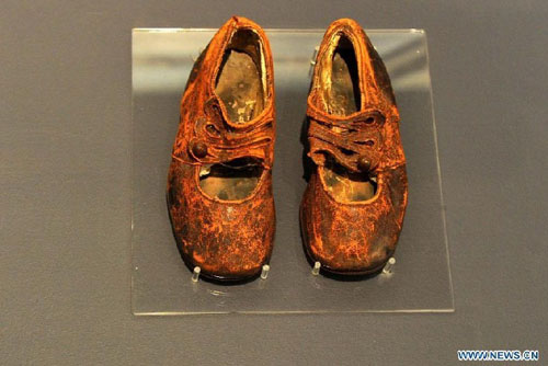 A pair of shoes of Sidney Leslie Goodwin is on display at the Maritime Museum of the Atlantic in Halifax, Canada, April 14, 2012. Sidney Goodwin was a 19-month-old English boy who died during the sinking of the Titanic. For decades he was referred to as 