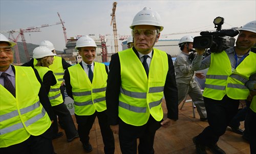 French Prime Minister Jean-Marc Ayrault (center) visits the Sino-French Taishan Nuclear Power Plant outside the city of Taishan in Guandong Province on Sunday. Photo: AFP