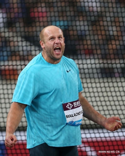 Poland's Piotr Malachowski celebrates after winning the men's discus throw during the IAAF Diamond League Athletics meet in Shanghai, east China, May 18, 2013. Malachowski won the first place of the event with 67.34 meters.(Xinhua/Li Ming) 