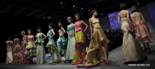 Models present creations of Indonesian brand Jeanny Ang Couture's 2013 spring/summer series at the 11th 
