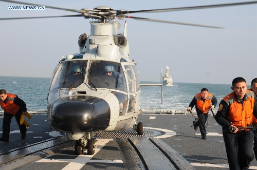 A Chinese People's Liberation Army (PLA) Navy fleet has set off from a military port in east China's Qingdao City for regular open-sea training in the West Pacific Ocean, military sources revealed Wednesday. (Xinhua/Li Yun) Related:Chinese navy depart for West Pacific trainingMISSILE DESTROYER QINGDAO, Jan. 30 (Xinhua) -- A Chinese People's Liberation Army (PLA) Navy fleet has set off from a military port in east China's Qingdao City for regular open-sea training in the West Pacific Ocean, military sources revealed Wednesday.The fleet departed Tuesday morning and comprises three ships -- the missile destroyer Qingdao and the missile frigates Yantai and Yancheng -- carrying three helicopters, all from the North China Sea Fleet under the PLA Navy.Full story