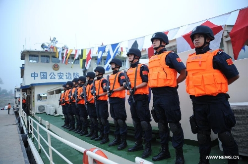 Chinese policemen are fully prepared to start off to carry out the joint anti-drug campaign on the Mekong River at the Guanlei Port in Xishuangbanna, southwest China's Yunnan Province, April 20, 2013. It is the ninth joint action of China, Laos, Myanmar and Thailand since a joint statement on the river's safety by the four nations dated Oct. 31, 2011. The Mekong river is a major Southeast Asian trading route, where narcotics crimes continue to rage. (Xinhua/Wang Dingbin) 