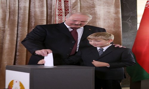 Belarus’s President Alexander Lukashenko (left) casts his ballot with his son Nikolay during voting in Minsk on Sunday. The ex-Soviet state holds parliamentary elections, two years after a presidential poll ended in the beating and arrest of hundreds of protesters. Photo: AFP
