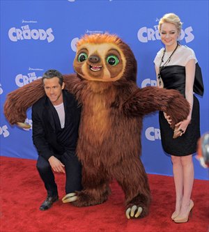 Ryan Reynolds (left) with Emma Stone at the premiere of The Croods in New York Photo: CFP