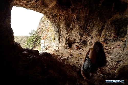 The picture taken on May 19, 2013, shows a reconstructed habitation of the Mousterian culture (about 100,000 to 40,000 B.C.) in Jamal Cave on the western slopes of the Mount Carmel range near Israeli northern city of Haifa. Sites of human evolution at Mount Carmel, including the caves of Tabun, Jamal, el-Wad and Skhul, were recognized as World Heritage Site by United Nations Educational, Scientific and Cultural Organization in 2012. (Xinhua/Yin Dongxun)
