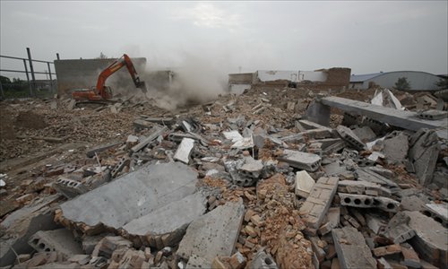 Authorities in Xi'an, Shaanxi Province forcibly demolished a number of buildings on July 2. The buildings are believed to have been illegally built and no compensation was offered for their destruction. Photo: CFP