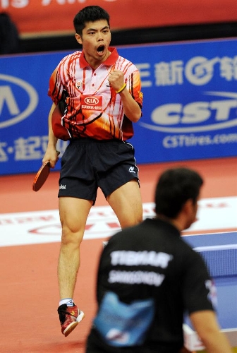 Chinese Taipei's Chuan Chih-Yuan of Team Asia celebrates for a point during the match against Belarus' Vladimir Samsonov of Team Europe at the 2013 Asia-Europe Table Tennis All Stars Challenge in Qingdao, east China's Shandong Province, March 17, 2013. Team Asia won 7-3. (Xinhua/Li Ziheng) 