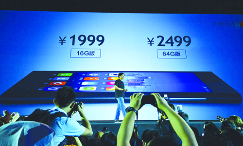 Attendees snap photos at Xiaomi's Mi-3 phone launch in September. The 16GB version sells for 1,999 yuan ($327.26) and the 64GB model costs 2,499 yuan. Photo: CFP