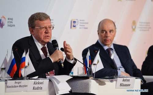 Former Russian Finance Minister Alexei Kudrin (L) addresses the Gaidar forum in Moscow, Russia, Jan. 16, 2013. The annual forum brought together Russian and international businessmen and experts to discuss the integration of Russia into the global economy. (Xinhua/Jiang Kehong) 