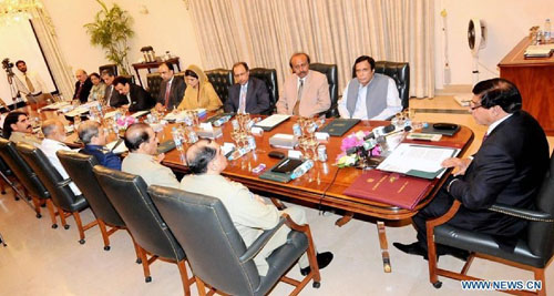 Photo released by Pakistan's Press Information Department (PID) on July 3, 2012, shows Pakistani Prime Minister Raja Pervez Ashraf (1st R) chairs a meeting of Defense Committee of Cabinet (DCC) in Islamabad, capital of Pakistan. Pakistan on Tuesday night announced that it is reopening land routes for NATO forces in neighboring Afghanistan after US Secretary of State, Hillary Clinton, apologized over the killing of 24 Pakistani soldiers in last November air strike, the country's Information Minister, Qamar-uz-Zaman Kaira said. Photo: Xinhua/PID